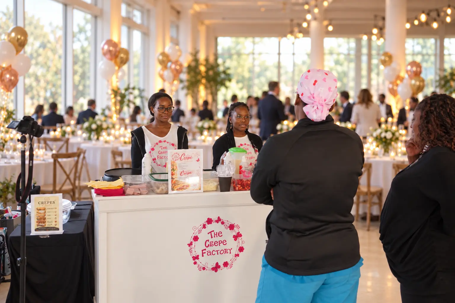The Crepe Factory team serving guests at a wedding celebration